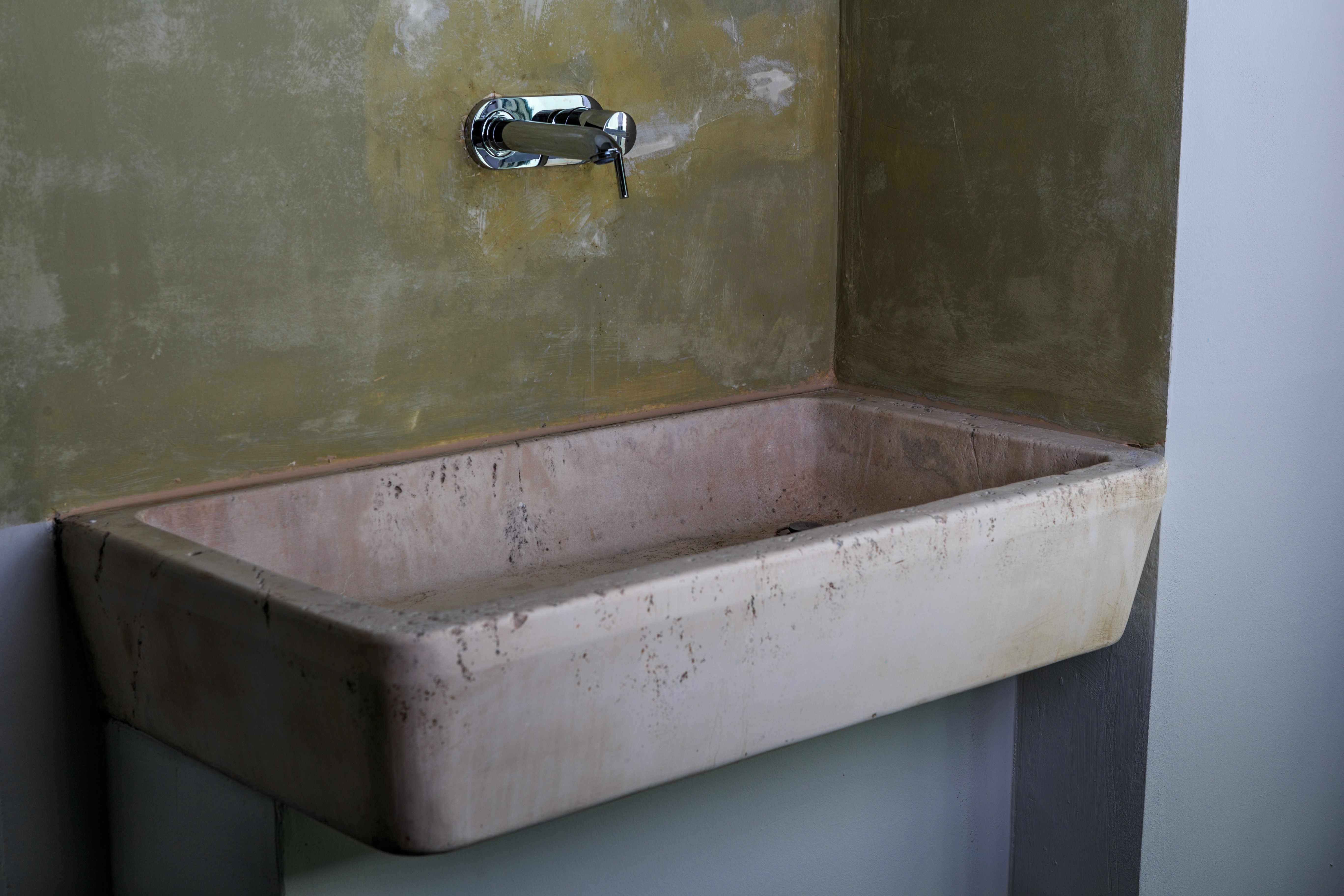 Old stone washbasin in the residence