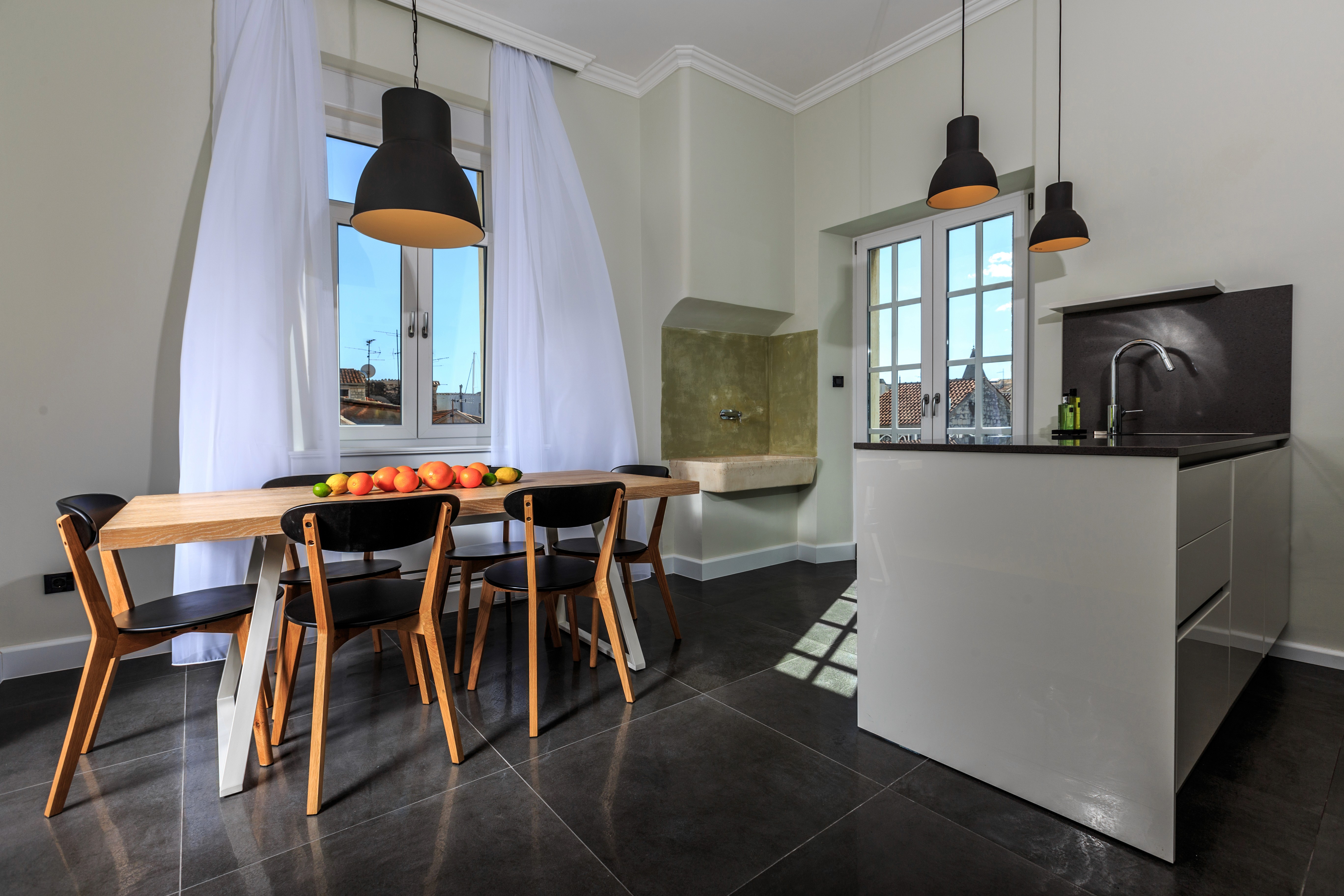 Kitchen and dining area with a view over the roofs